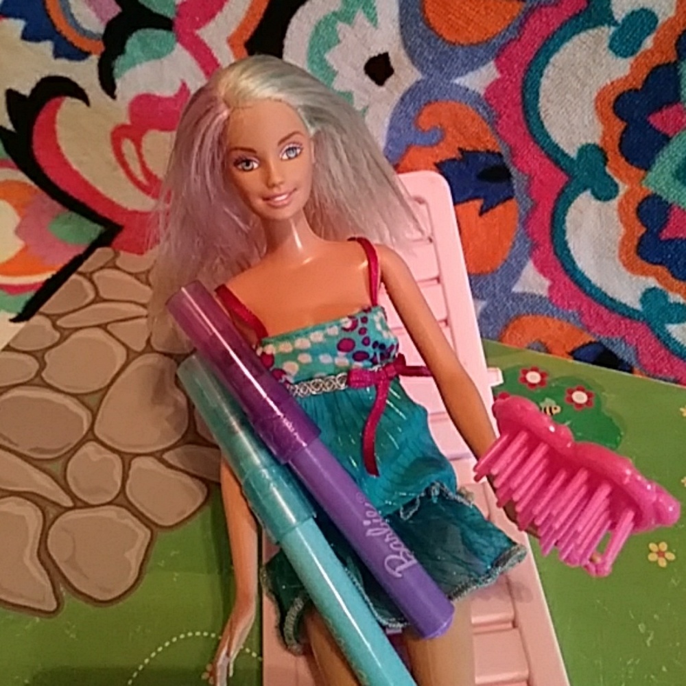 Barbie doll ,2 hair markers'a brush,and a dress